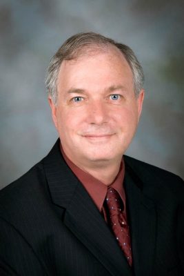 Portrait of Alan Drushitz in a suit