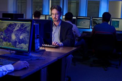 Chris Zobel works on a computer model.