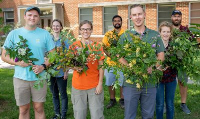 People hold invasive plant species. 