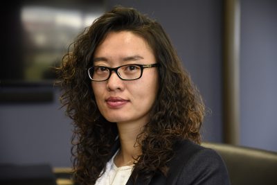 Image of woman in a conference room shallow depth of field