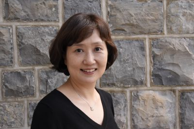 Woman standing against Hokie Stone