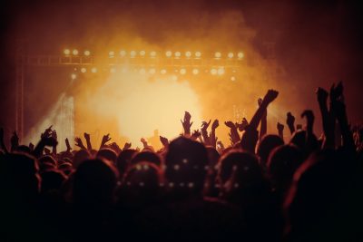 Arms raised at a live event