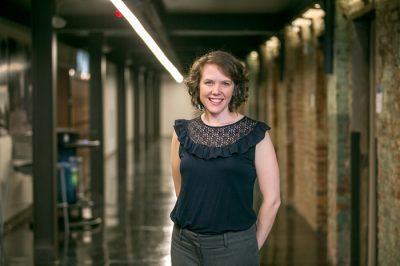 Woman standing in hallway of research center